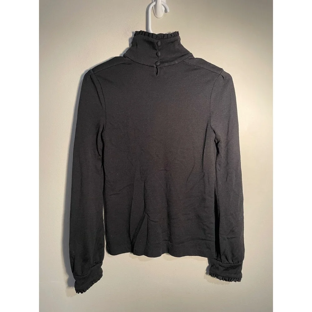 Diane von Furstenberg Black Wool Turtleneck‎ Ruffle Hem Top Size 10 Quiet Luxury